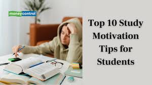 Student studying for exams with notes and laptop at desk