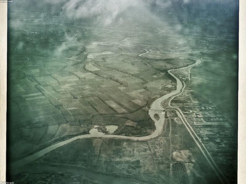 Aerial view of a historic city nestled in a dry mountainous valley