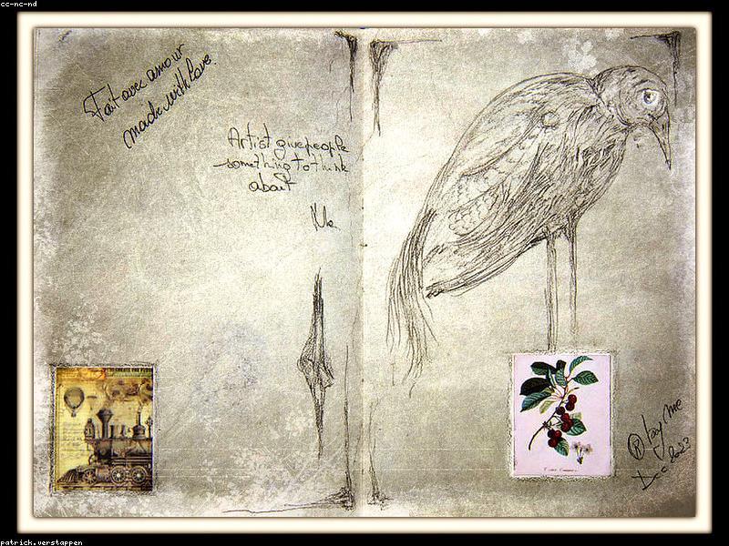 Open notebook with pen on a wooden desk