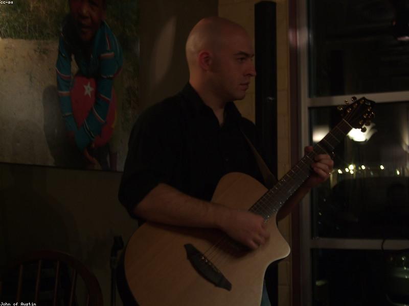Couple enjoying a live music show in Austin at night