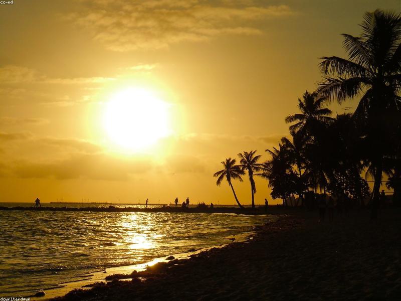 Couple watching sunset at Mallory Square in Key West with performers