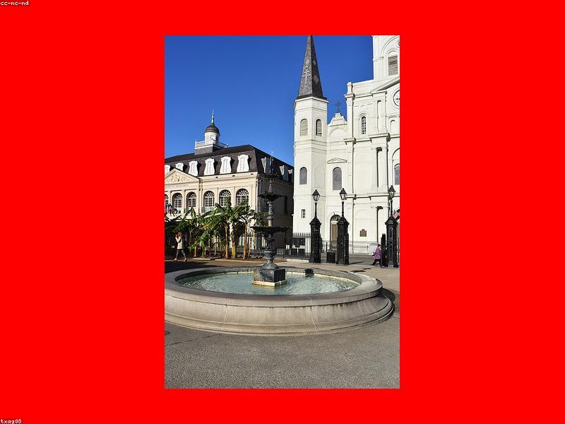 Couple walking through the French Quarter with jazz musicians in background