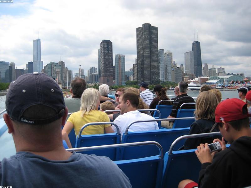 Couple on a river cruise admiring Chicago skyline