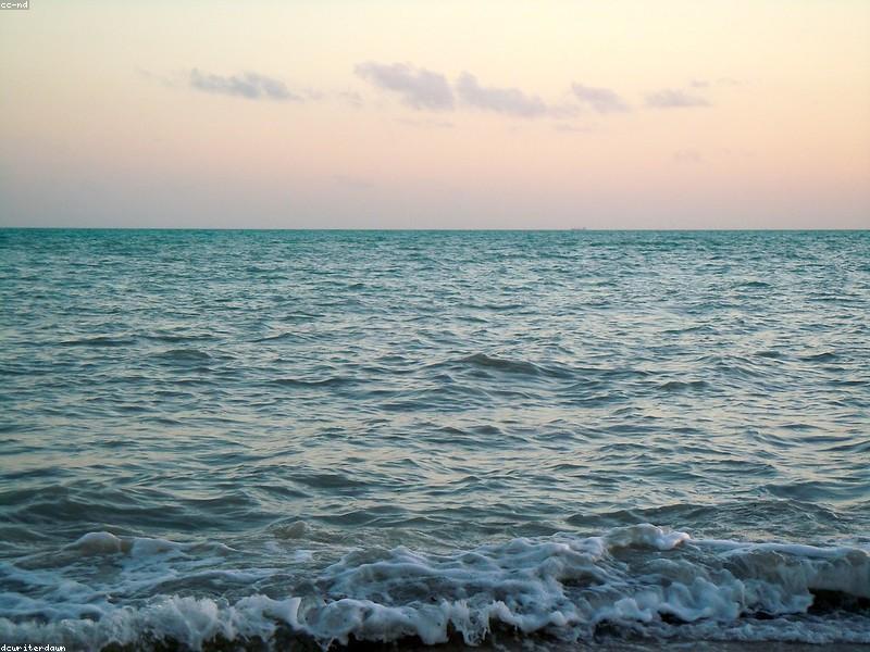 Couple watching sunset at Mallory Square in Key West with performers