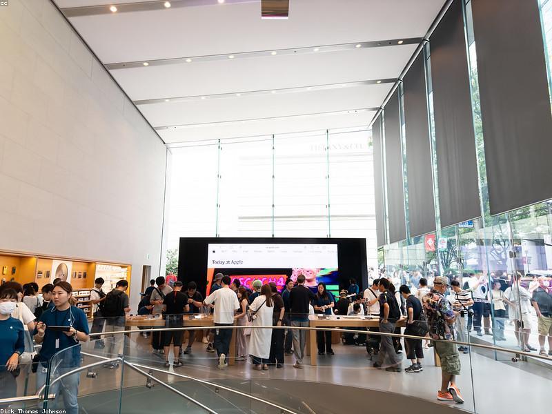 Apple Store glass entrance with customers inside